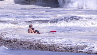 Teenage Lifeguard Fights Intense Waves to Bring Boy to Safety