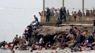 Hundreds of migrants swim from Morocco to Spanish enclave of Ceuta