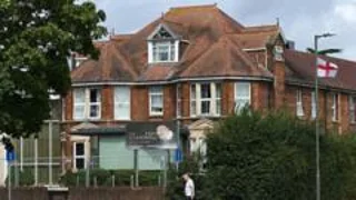 Man arrested on suspicion of attempted murder after incident at Surrey asylum hotel