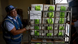 Judge clears the way for Postal Service work on Trump's mail-in voting order for now