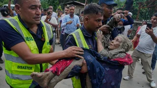 At least 75 killed and hundreds missing after flash floods in Nepal and China
