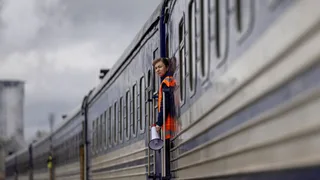 Bulletproof vests and blacked-out carriages: How Ukraine defies Putin to keep trains moving