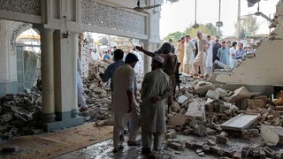 At least 16 killed in car bomb at mosque near police compound in Pakistan