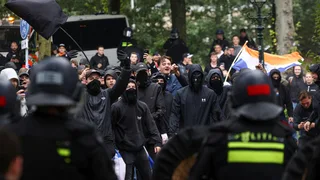 Police clash with hundreds of far-right protesters in The Hague