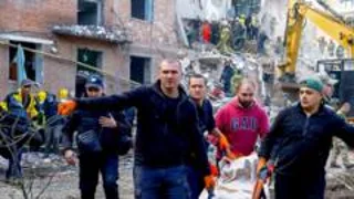 Children killed while they slept as Russian missile kills 19 in block of flats