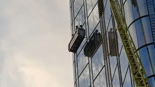 Window cleaners rescued from skyscraper