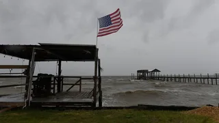 'The storm is here - buckle down': Hurricane Isaias makes landfall in US