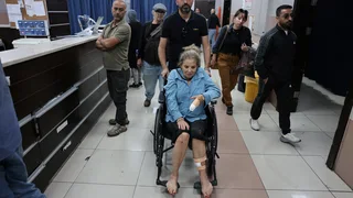Israeli settlers beat Palestinians and a U.S. photojournalist in West Bank attacks