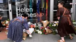 Man charged with attack on Australian MP as suspect's father says she is family friend