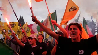 Soldiers guard center of Milan as thousands of protesters march in cities across Europe