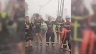 Firefighters celebrate rain during Indonesia wildfires